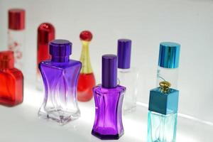 multicolored perfume bottles blurred background photo