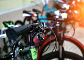 Selective focus of colorful kid bicycles being displayed for sale in a supermarket photo