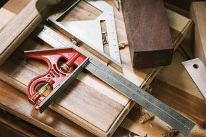 Combination Square Stainless steel ruler with Precision Level on table,woodworking concept.selective focus. photo