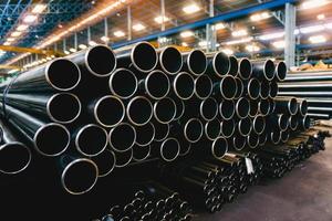high quality Galvanized steel pipe or Aluminum and chrome stainless pipes in stack waiting for shipment  in warehouse photo