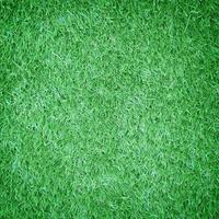 Artificial green grass texture for background photo