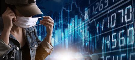 Woman wearing a mask isolated on blue graph chart of stock market investment with indicator and volume trade, Financial data on a monitor. photo