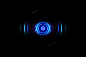 Abstract glowing circle blue light effect on black background photo