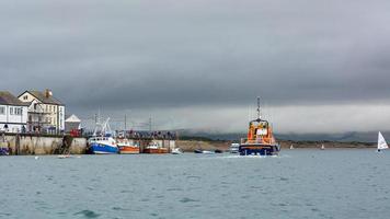 APPLEDORE, DEVON, UK, 2013. Lifeboat leaving photo