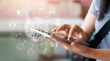 Woman using mobile payments online shopping and icon customer network connection on screen, m-banking and omni channel photo