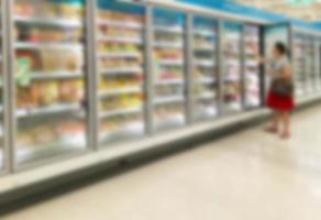 Commercial refrigerators in a large supermarket photo