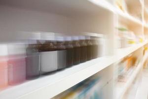 Pharmacy store shelves with motion blur photo