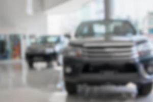 View of row new car at new car showroom blurred background photo