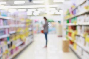 Woman shopping in supermarket photo