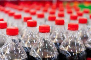 Bottles with soft drinks photo