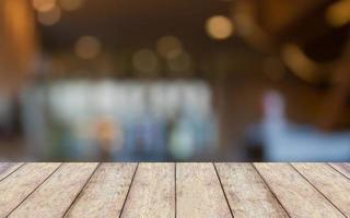 Empty wooden table and interior background, product display,blurred store with bokeh photo