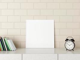 Minimalist square white poster or photo frame mockup on the desk with books and alarm in room. 3D Rendering.