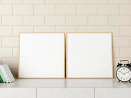 Minimalist square wood poster or photo frame mockup on the desk with books and alarm in room. 3D Rendering.