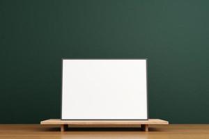 Minimalist and clean horizontal black poster or photo frame mockup on the wooden table in living room. 3D Rendering.