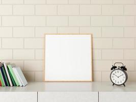 Minimalist square wood poster or photo frame mockup on the desk with books and alarm in room. 3D Rendering.