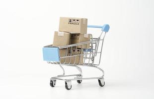 Isolated of shopping cart trolley with paper boxes on white background for online shopping and delivery concept. photo