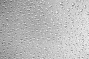 Water droplets on gray background covered with water droplets, bubbles in water. photo