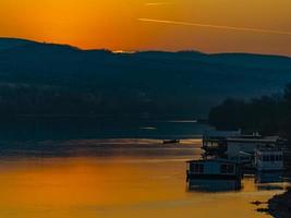 Sunset over calm Danube river  in Novi Sad, Serbia photo