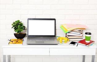 Workspace with computer and notebook. Copy space and top view. Selective focus photo