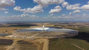 Aerial drone view of Gemasolar Thermosolar Plant in Seville, Spain. Solar energy. Green energy. Alternatives to fossil fuel. Environmentally friendly. Concentrated solar power plant. Renewable energy. photo