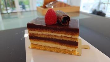 Close up Opera cake at the a La carte desserts , cakes on a white background. Selective focus photo