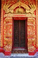 sculpture base and door of Thai architecture style lanna in north Thailand photo