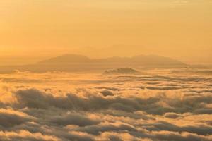 Beautiful sunrise with the mountains covered by mist and clouds in Shan state, Myanmar. photo