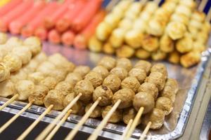 Meatballs on skewers with blurred background photo