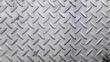 Silver color non slip metal floor pattern and texture background photo