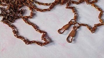 Gold colored chain which is usually used for bag straps. photo