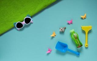 Set of baby beach accessories on light background photo