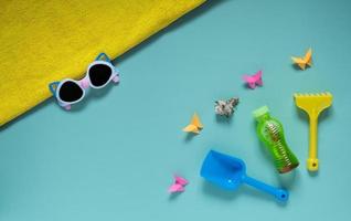 Set of baby beach accessories on light background photo