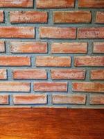 vertical orange square shelf brick block on cement wall textured and background. strong interiors house building.