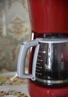 Glass coffee jug with a drink on a white background photo