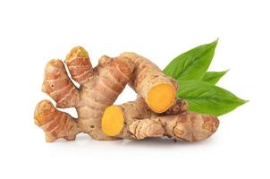Turmeric Curcuma longa Linn rhizome root sliced with green leaves isolated on white background with Clipping Path. photo