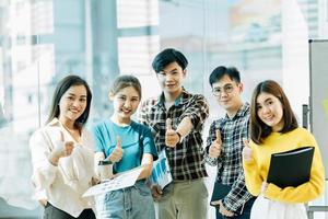 Business leaders with employees group showing thumbs up looking at camera, happy professional multicultural office team people recommend best corporate service, proud or good career, human resource photo