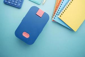 top view of a lunch box on color background photo