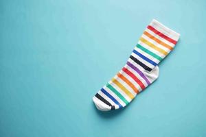 colorful sock on green background with copy space , photo