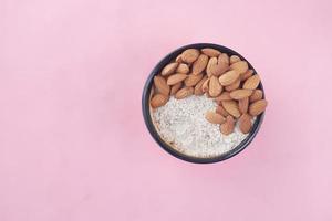 almond powder and almond in a jar on table, photo