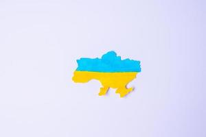 Support for Ukraine in the war with Russia,  the shape of Ukraine border with color flag. Pray, No war, stop war and stand with Ukraine photo