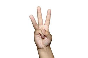 Boy raising tree fingers up on hand on white background. photo