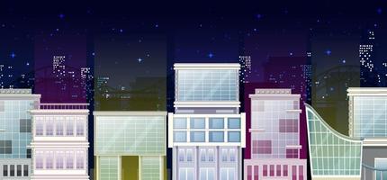 vista del edificio de la ciudad por la noche vector
