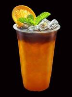 Iced Americano coffee mixed with orange juice with orange slices and mint leaves on isolated. photo