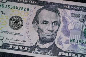US Dollars on black background. photo