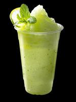 Smoothies mixed apple and lemon with lemon slices and mint leaves on isolated. photo