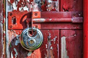 Shiny New Padlock on an Old Door photo