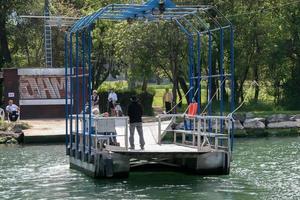 COTE D'AZUR, FRANCE, 2006. Passenger ferry across a canal photo