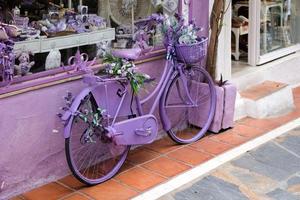 MARBELLA, ANDALUCIA, SPAIN, 2017. Lavender Bicycle outside a Shop photo