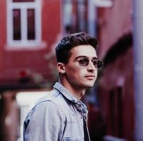 close-up portrait of a man in sunglasses photo