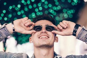 man smiling with glasses photo